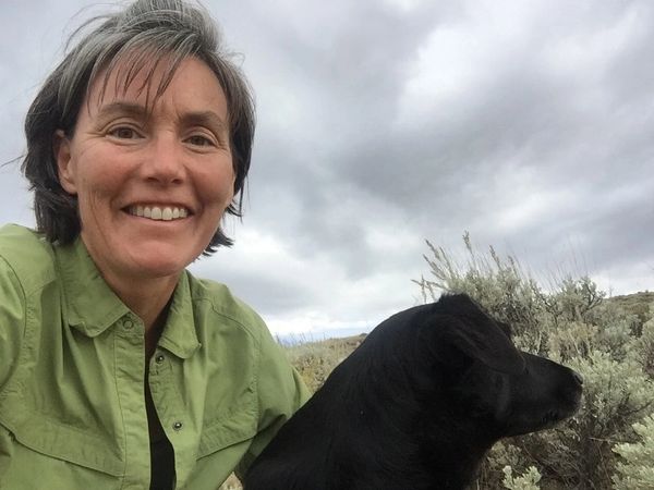 Amy Layne Litzelman and dog, Ruby, camping in mountains of WY