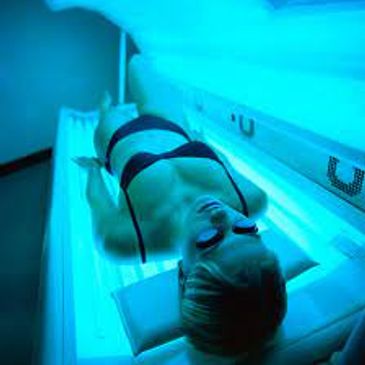 Woman using sunbed