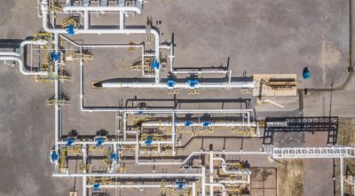 Aerial view of industrial pipelines and valves.