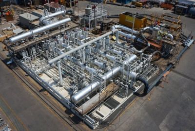 Industrial machinery with numerous pipes and valves.