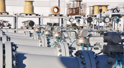 Industrial pipes with gauges and valves.