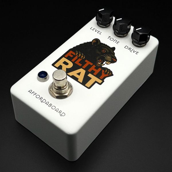 White Filthy Rat guitar effects pedal with three black knobs and a footswitch.