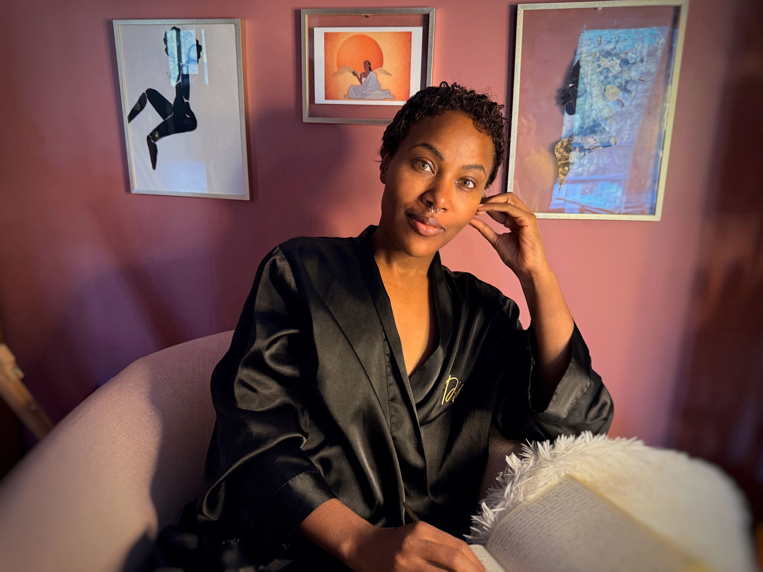 DeWanda lounges in her meditation room, ready to write in her journal.