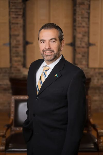 Professional man in a suit with a striped tie.