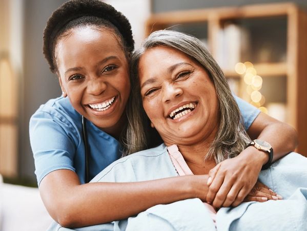 Senior care, hug and portrait of nurse with patient for medical help, healthcare or physiotherapy.