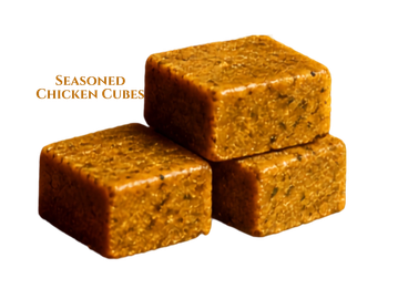 Three seasoned chicken cubes stacked together.