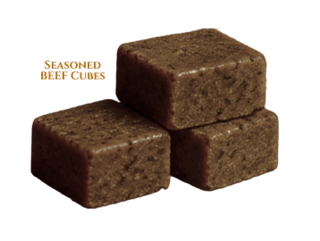 Three seasoned beef cubes stacked together.