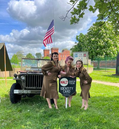 The Rockabilly Dolls vintage trio standing in front of a willys jeep at The Starbucks Regiment