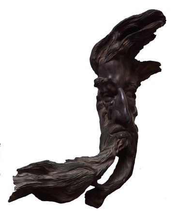 Sculptor Tomas Oliva, a sculpture of an old man's head, wood, 1973