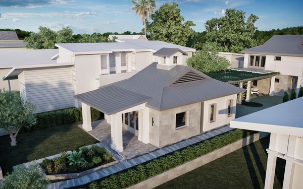 Modern house with a unique roof design surrounded by greenery.