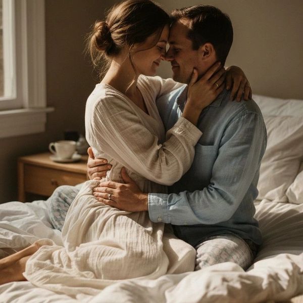 couple cuddling in bed after regaining sexual intimacy with hormone replacement therapy in Owasso