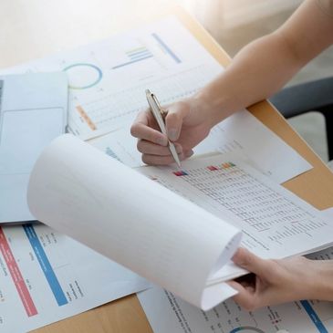 close up woman working with graph data at office, financial report concept
