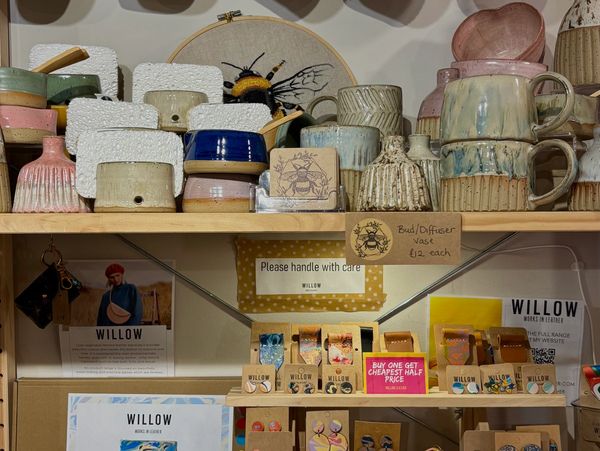 Handmade pottery and jewellery on shelves
