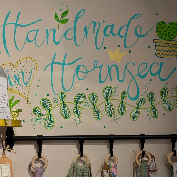 Words 'handmade in Hornsea' painted on a wall