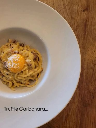 Truffle Carbonara pasta with egg yolk.