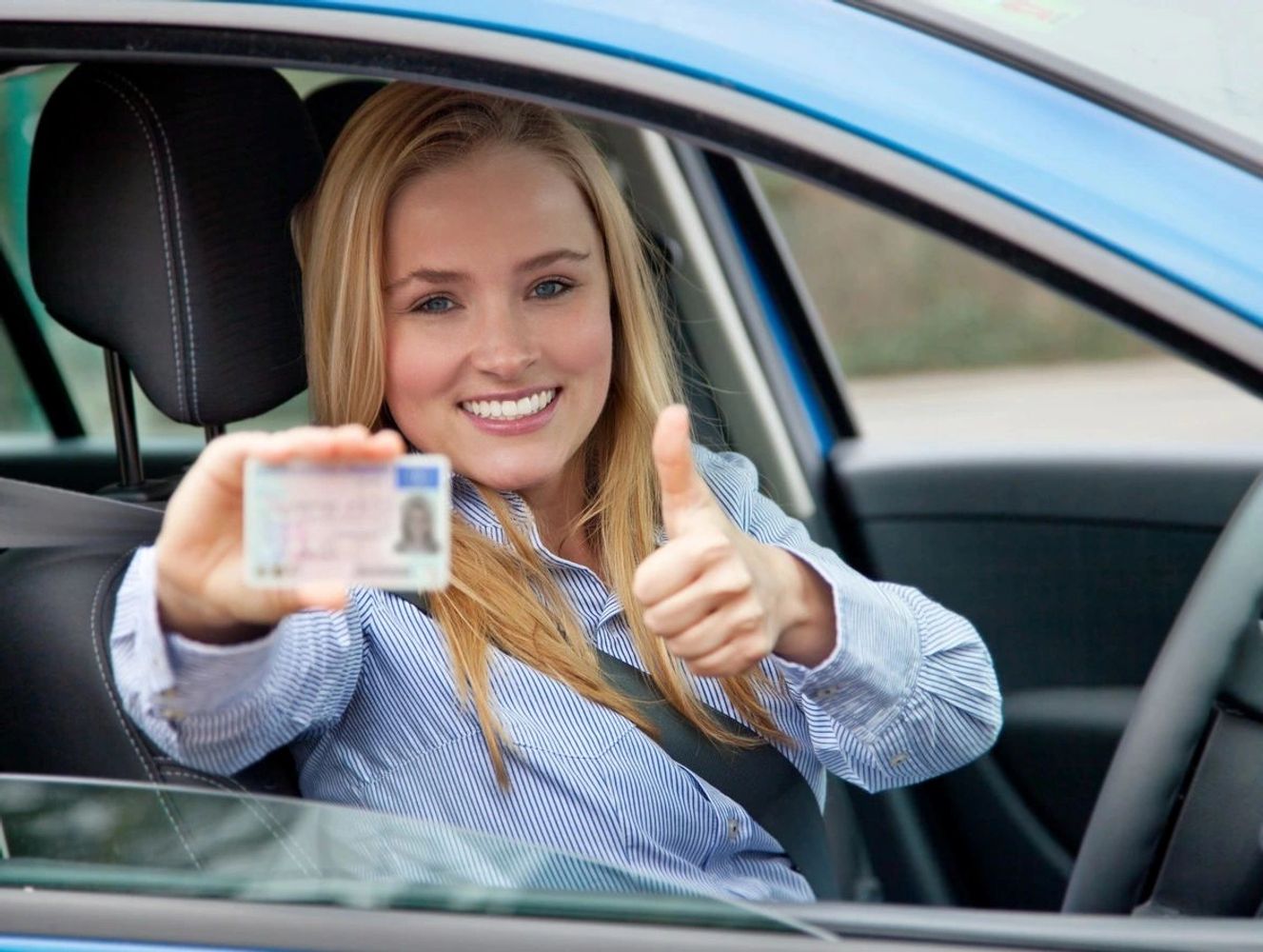 Driver showing driving licence. Passed driving test.