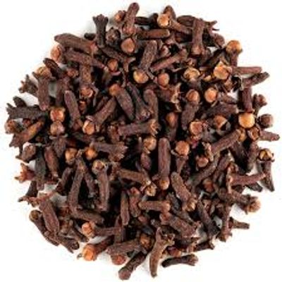 A pile of dried cloves on a white background.