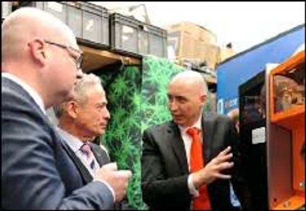 Dr Conor MacCormack explaining how Mcor's 3D printer works to Richard Bruton TD & Ged Nash TD