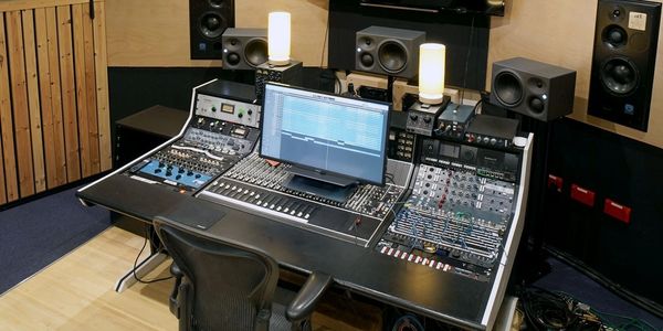 Modern music production studio with mixing console and monitors - Blank Studios
