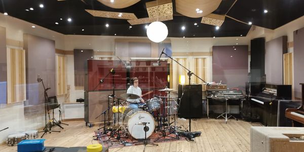 Musician playing drums in a professional recording studio - Blank Studios