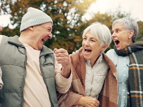 A group of friends looking at each other and laughing