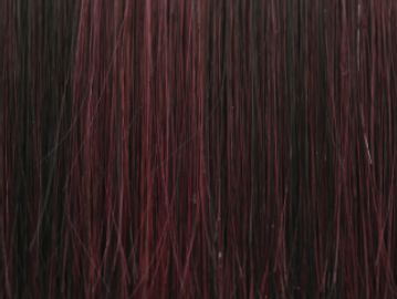 Close-up of dark hair with red highlights.