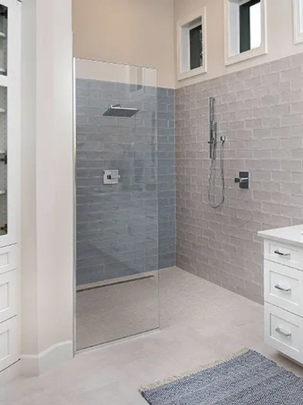 A zero threshold shower allows for safe, easy shower entry with room for mobility devices.

