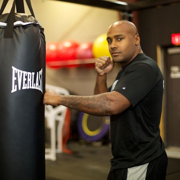 Personal Trainer Just Mitchell throwing punches at a Everlast punching bag