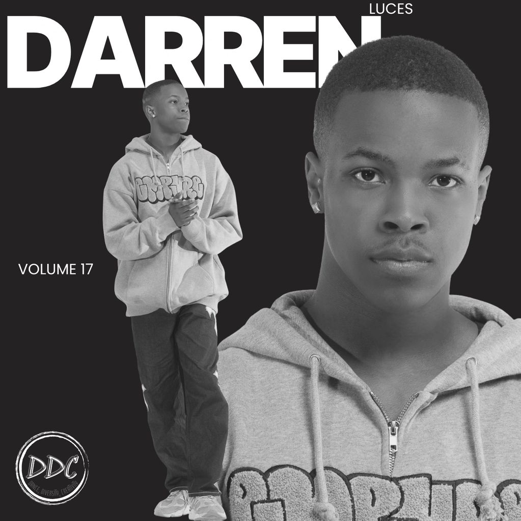 Black and white portrait of a young man in a hoodie.