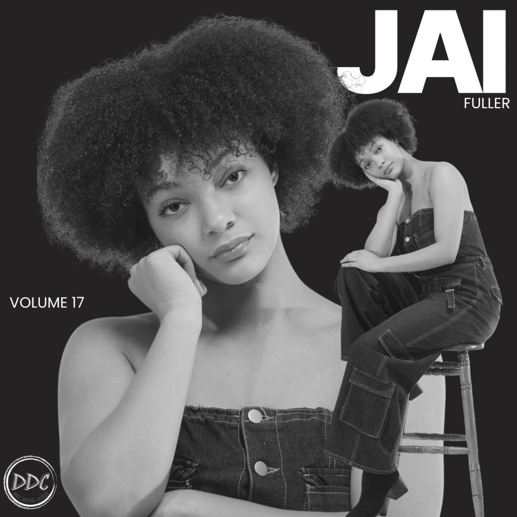 Black and white portrait of a woman with curly hair in denim.