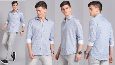 Young man modeling a light blue patterned shirt and light grey pants.
