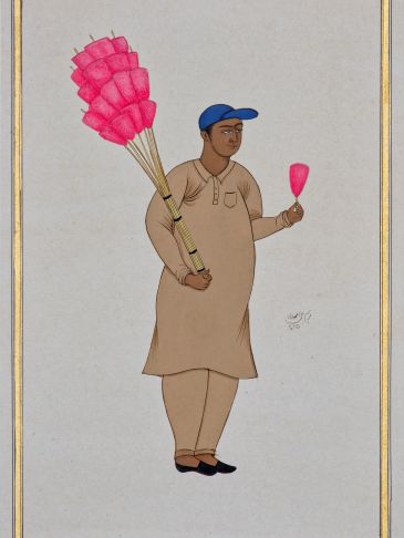 Man holding cotton candy sticks and a single cotton candy.