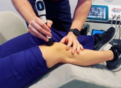 Person receiving a therapy treatment on their knee.