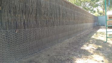 Dog proofing a brush fence