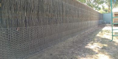 Dog proofing a brush fence