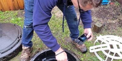 Bryan in the field performing a Septic System Inspection.