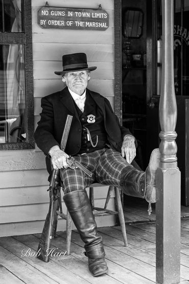 US Marshal on Veranda of his office awaiting trouble
