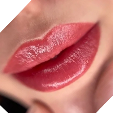 Close-up of lips with glossy red lipstick.