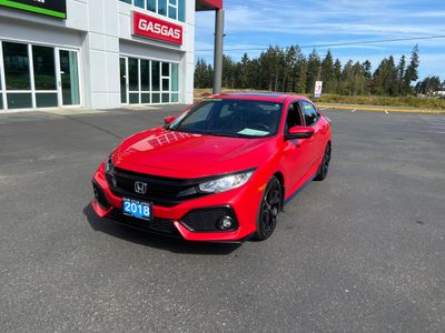 Red 2018 Honda Civic parked in front of a dealership.