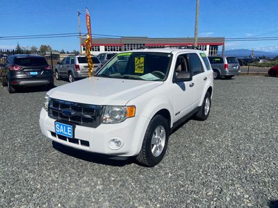 White SUV for sale in a lot.
