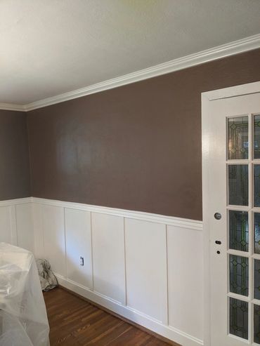 Plaster textured walls repaired and repainted.