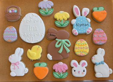 Colorful Easter-themed decorated cookies with names Tim and Nathan.