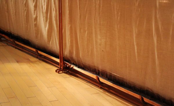 Cotton fabric wrapped around with copper tubes.