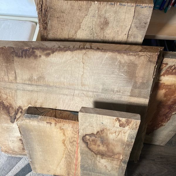 Oak wood slabs stacked ready for making wooden boards 