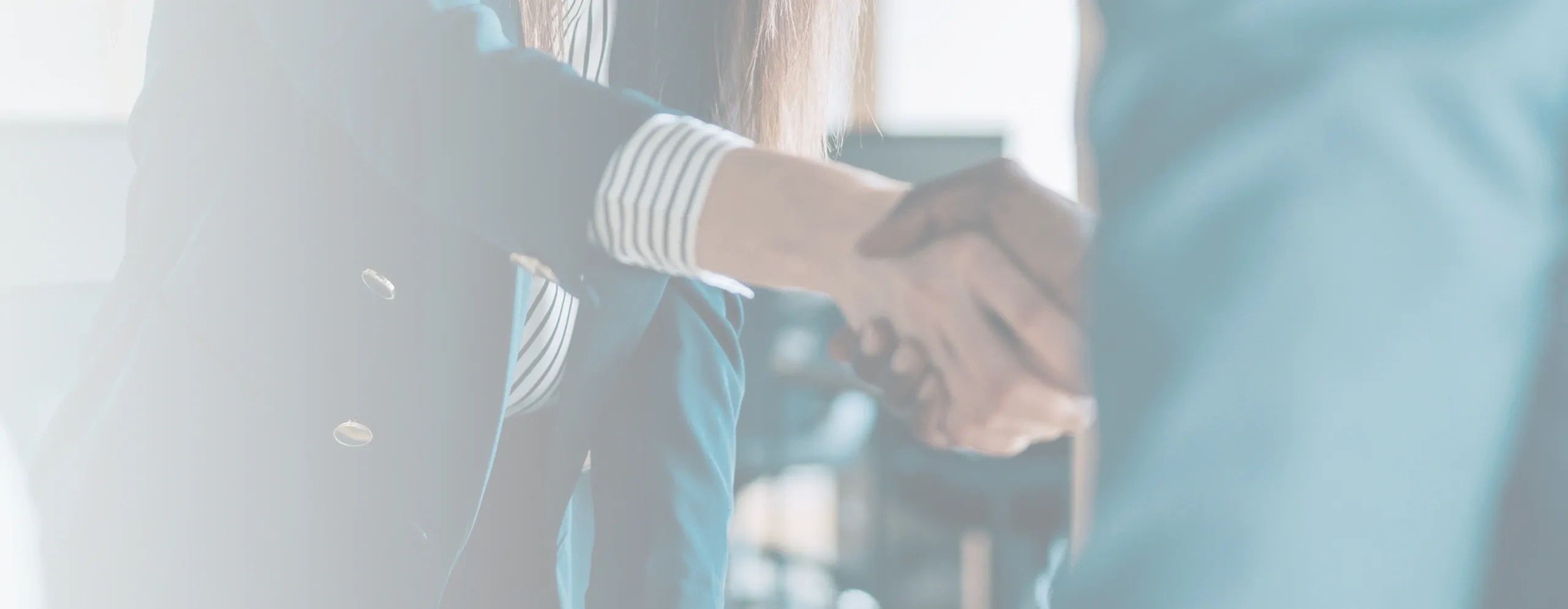 Business woman and business man shaking hands