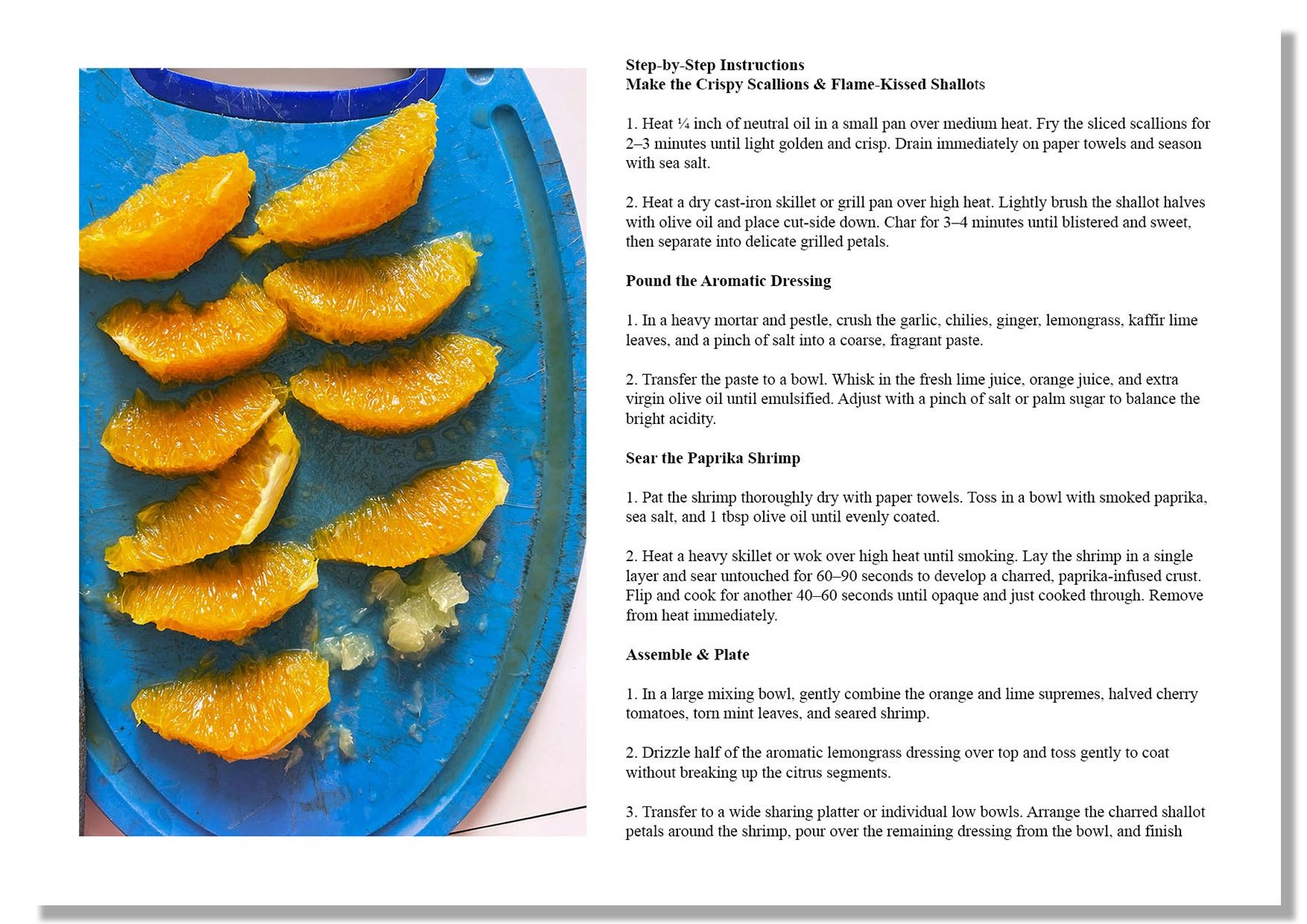Orange segments on a blue cutting board.