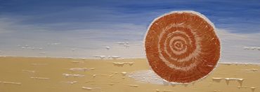 Calm beach scene with gold, bronze circular shell. Blues, yellow, whites.  12 x 32 inches. Acrylic P