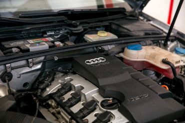 Close-up of an Audi TFSI engine under the hood.