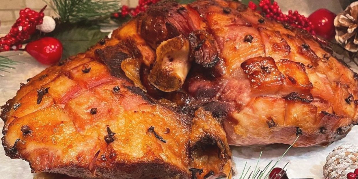 Close-up of a glazed ham with cloves.
