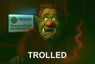 A green troll with glowing eyes and red nose labeled 'TROLLED'.